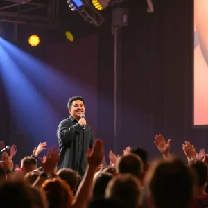 Comedy duo performing on stage with an enthusiastic audience