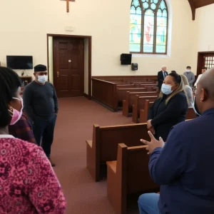 Community discussing safety measures in a church